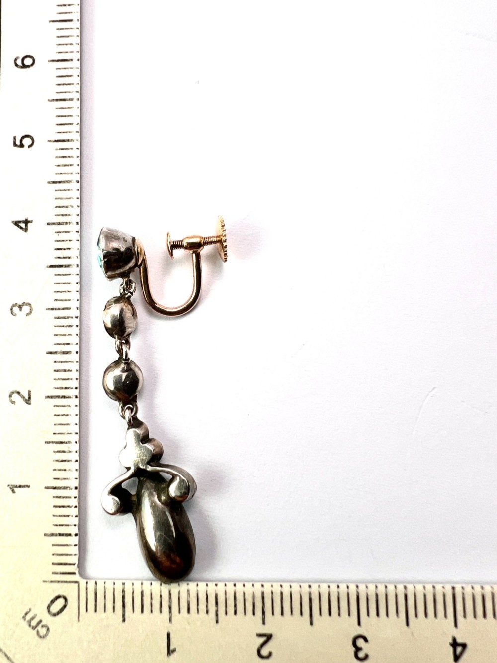 A pair of Victorian gold and silver drop earrings set with light blue and clear paste stones. View VI