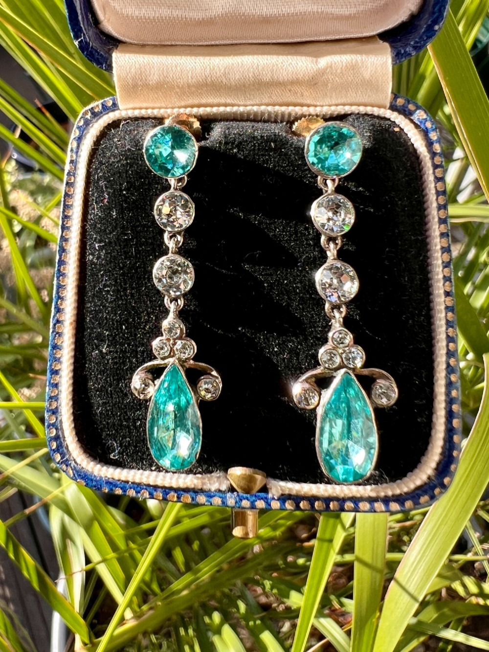 A pair of Victorian gold and silver drop earrings set with light blue and clear paste stones. View VII