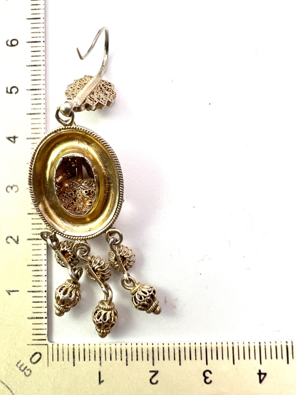 A pair of Victorian gilded silver filigree girandole chandelier earrings with triple dangling drops, displayed inside a velvet presentation box. View VI