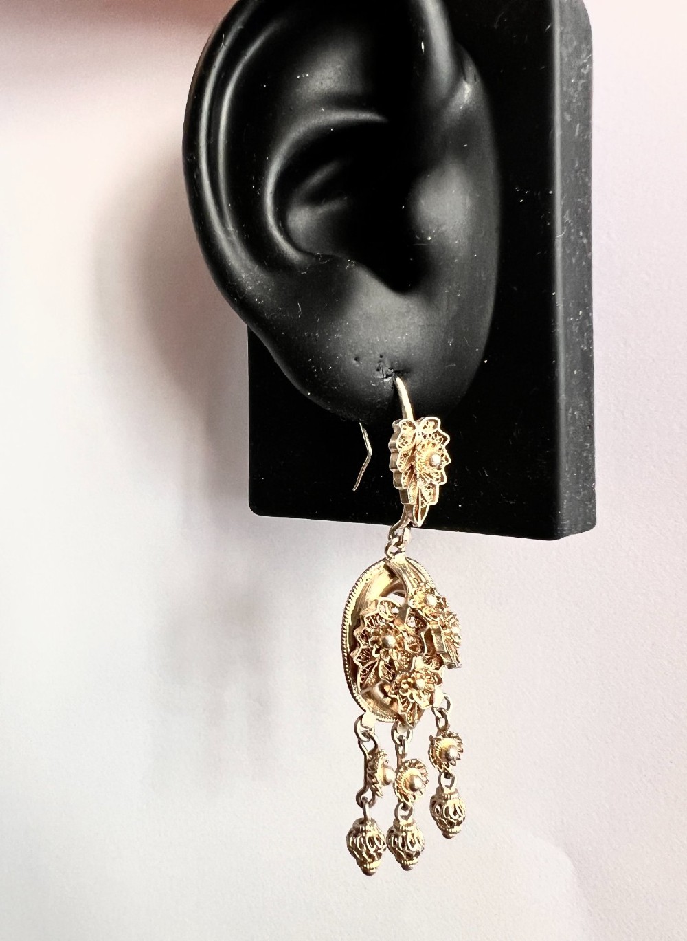 A pair of Victorian gilded silver filigree girandole chandelier earrings with triple dangling drops, displayed inside a velvet presentation box. View VII
