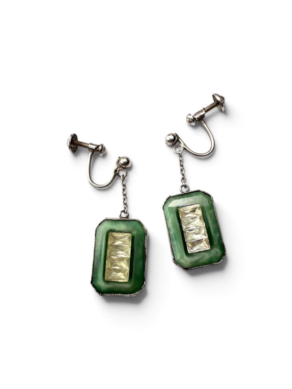 An Art Deco silver jewellery set featuring a rectangular ring and matching drop earrings inset with green glass plaques and clear step-cut paste stones. View III