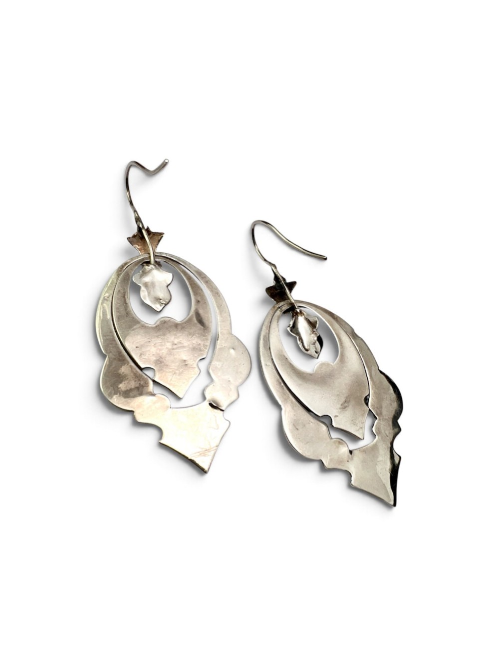 A pair of Victorian sterling silver drop pendant earrings featuring hand-engraved openwork panels inlaid with geometric red jasper, green moss agate, and grey banded agate stones. View VI