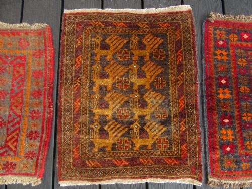 fig 1. A GROUP OF THREE SMALL OLD BALUCH SCATTER RUGS. GREAT FOR SCATTERING OVER LARGER RUG