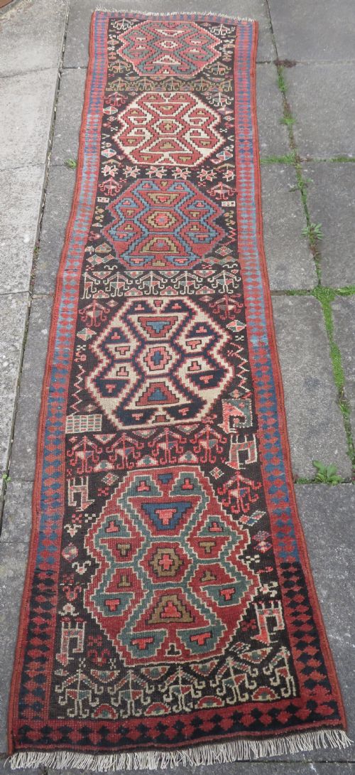 INTERIOR DESIGNEARLY ANTIQUE KURDISH NARROW RUNNERRUG NORTH WEST PERSIACIRCA 1860S 282CM X 74CM - ADDITIONAL PHOTO 1