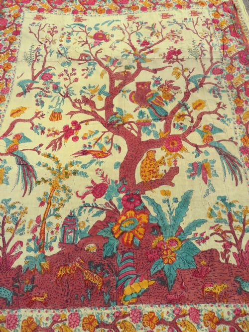 fig 1. An antique 19th-century yellow cotton palampore textile featuring a centrally printed Tree of Life with birds, animals, and a pink floral border.