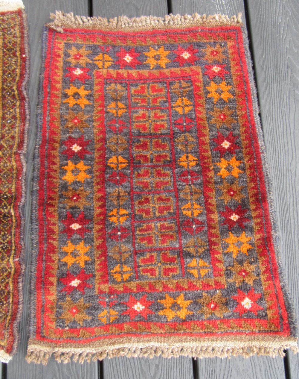 A GROUP OF THREE SMALL OLD BALUCH SCATTER RUGS. GREAT FOR SCATTERING OVER LARGER RUG View IV