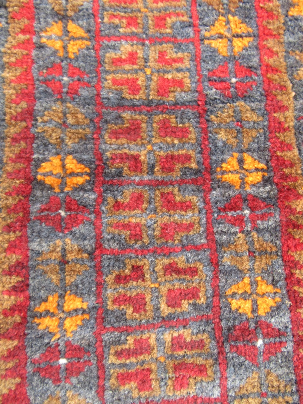 A GROUP OF THREE SMALL OLD BALUCH SCATTER RUGS. GREAT FOR SCATTERING OVER LARGER RUG View VII