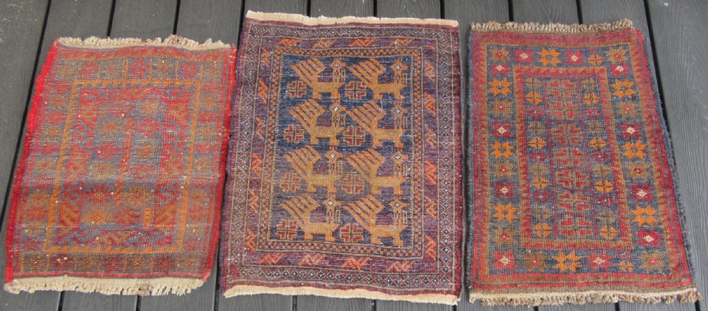 A GROUP OF THREE SMALL OLD BALUCH SCATTER RUGS. GREAT FOR SCATTERING OVER LARGER RUG View X