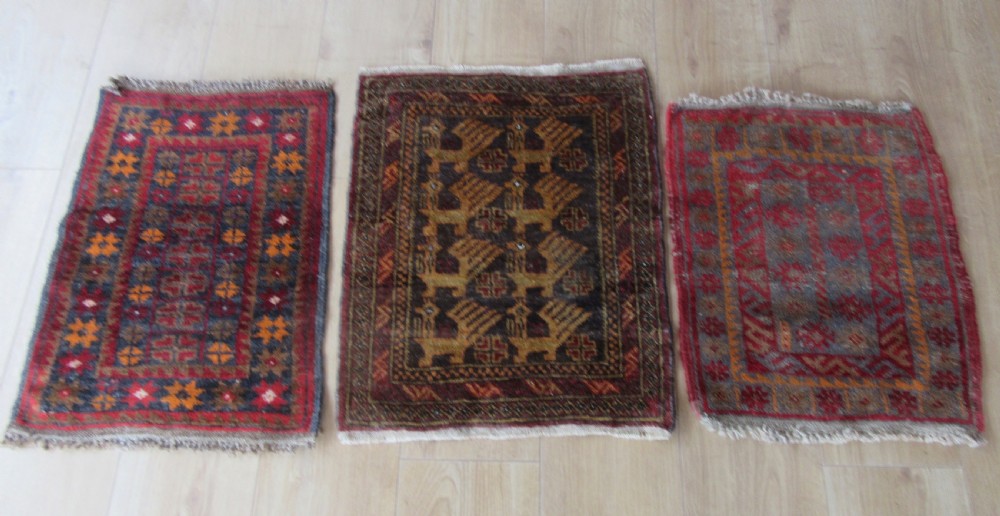 A GROUP OF THREE SMALL OLD BALUCH SCATTER RUGS. GREAT FOR SCATTERING OVER LARGER RUG View XIV