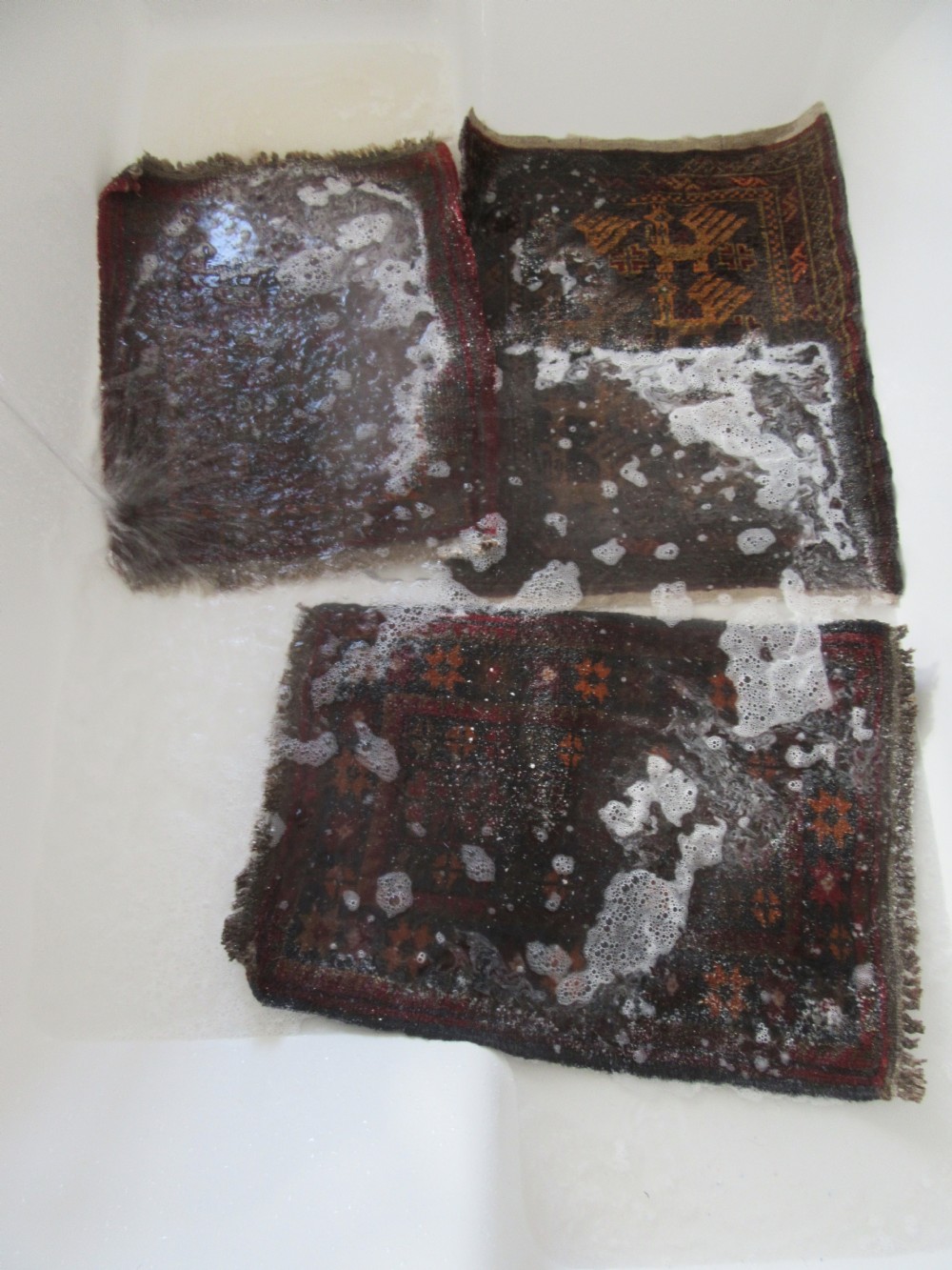 A GROUP OF THREE SMALL OLD BALUCH SCATTER RUGS. GREAT FOR SCATTERING OVER LARGER RUG View XVII
