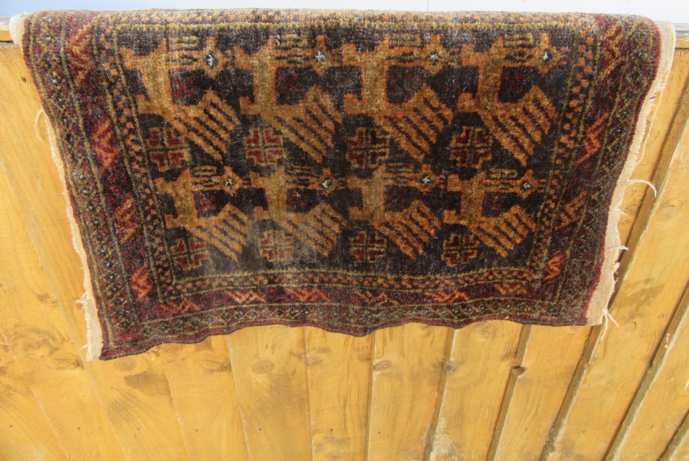 A GROUP OF THREE SMALL OLD BALUCH SCATTER RUGS. GREAT FOR SCATTERING OVER LARGER RUG View XX