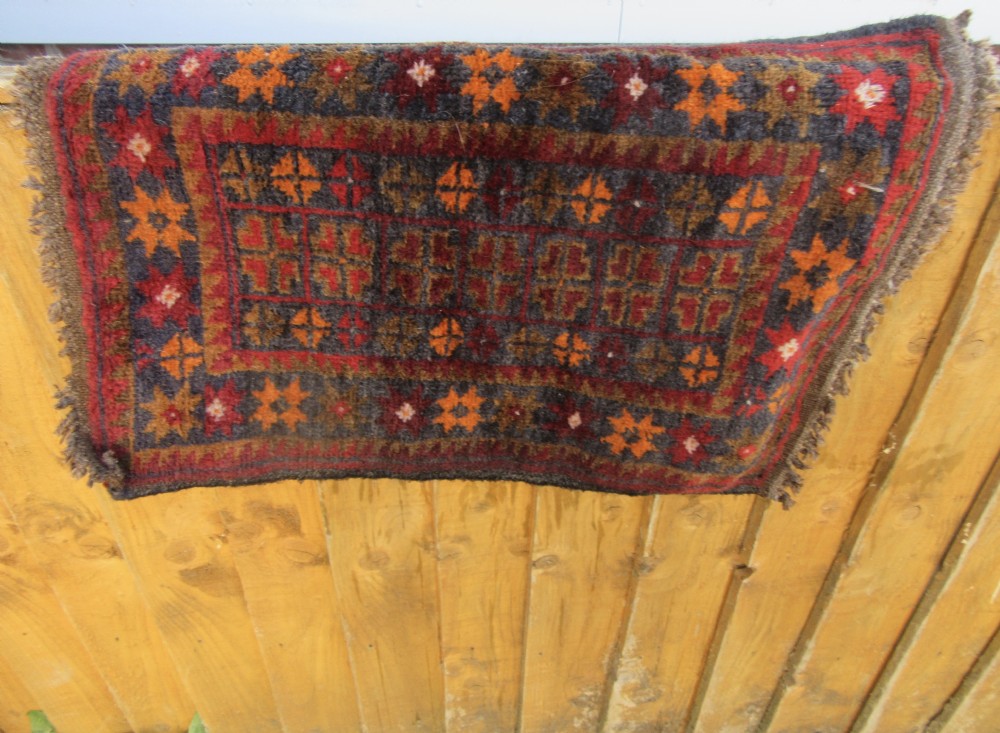 A GROUP OF THREE SMALL OLD BALUCH SCATTER RUGS. GREAT FOR SCATTERING OVER LARGER RUG View XXI