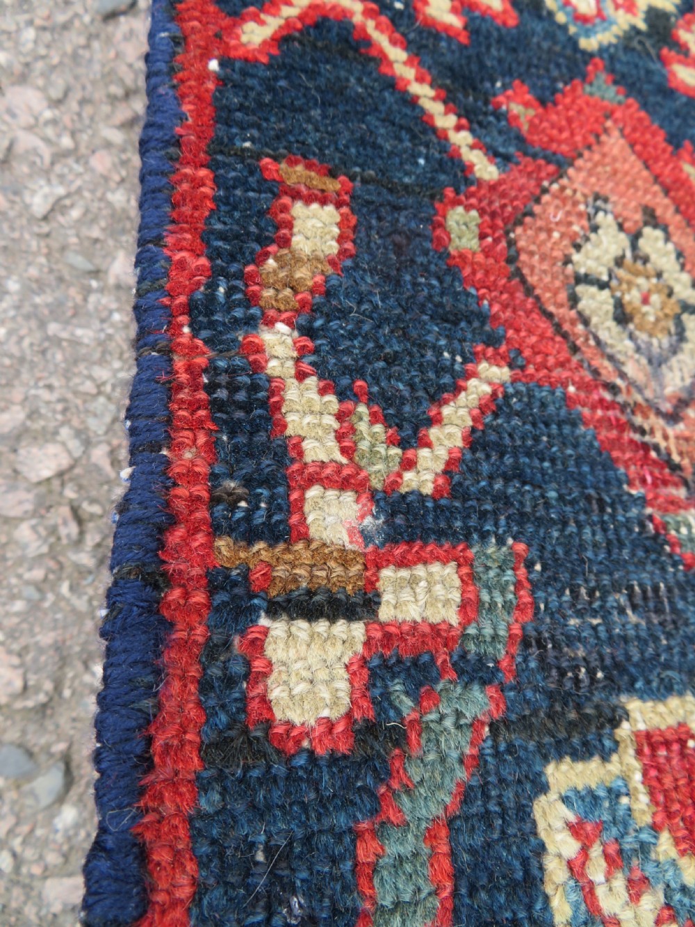 A long, narrow hand-knotted wool runner featuring a repeating geometric Mina Khana floral lattice pattern in navy blue, terracotta red, and cream tones. View XIII