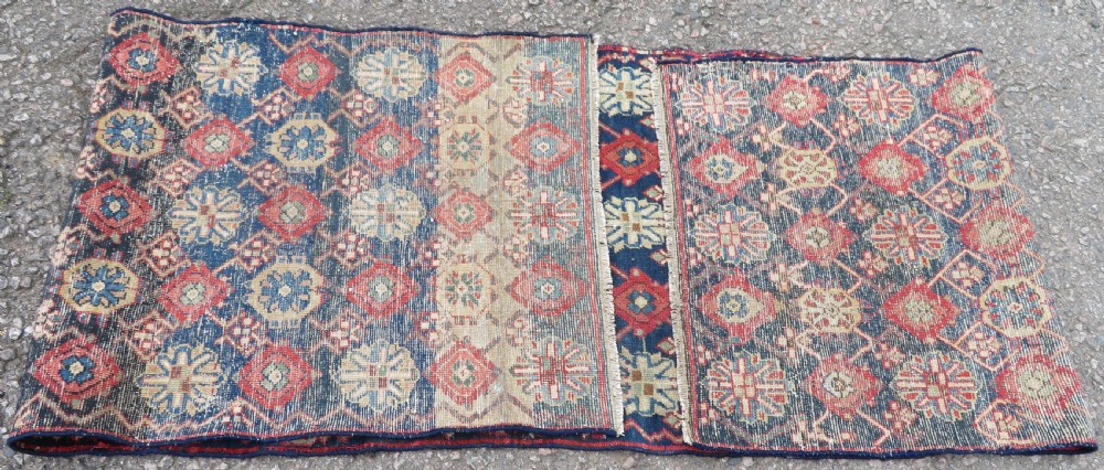 A long, narrow hand-knotted wool runner featuring a repeating geometric Mina Khana floral lattice pattern in navy blue, terracotta red, and cream tones. View XIX