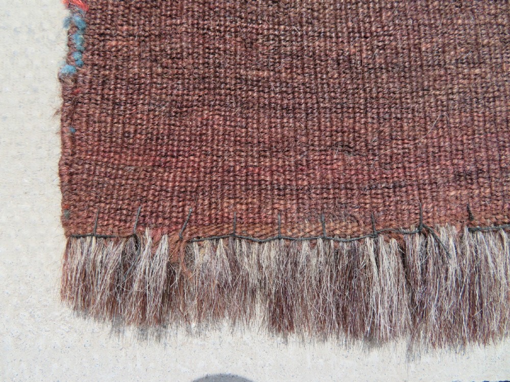 A rectangular hand-woven Yomut Turkmen wool chuval bag face featuring sixteen repeating central guls framed by geometric borders and a solid dark brown lower elem skirt. View XVII