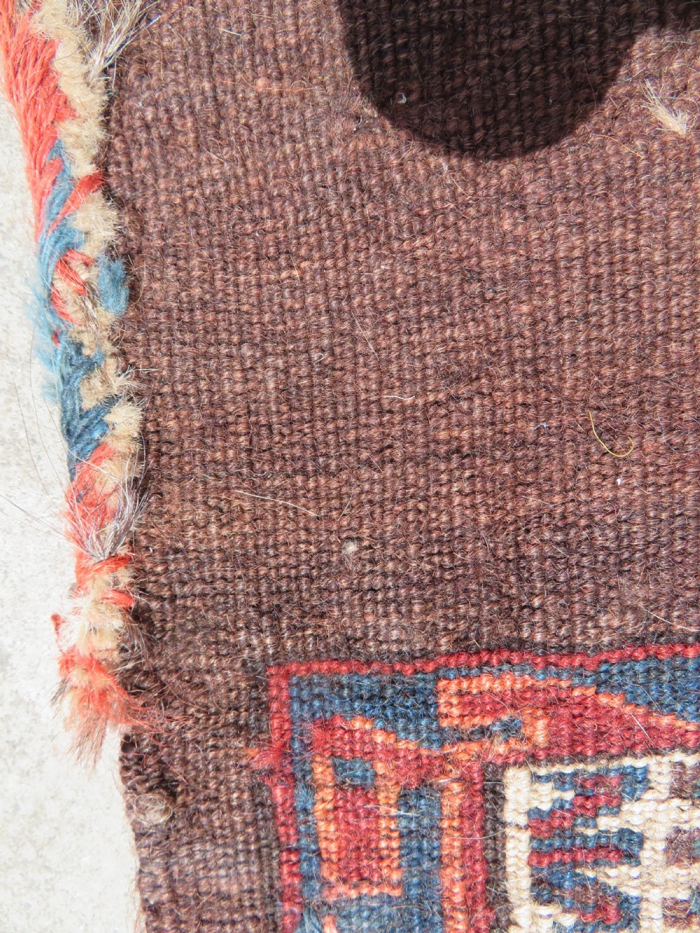 A rectangular hand-woven Yomut Turkmen wool chuval bag face featuring sixteen repeating central guls framed by geometric borders and a solid dark brown lower elem skirt. View XVIII