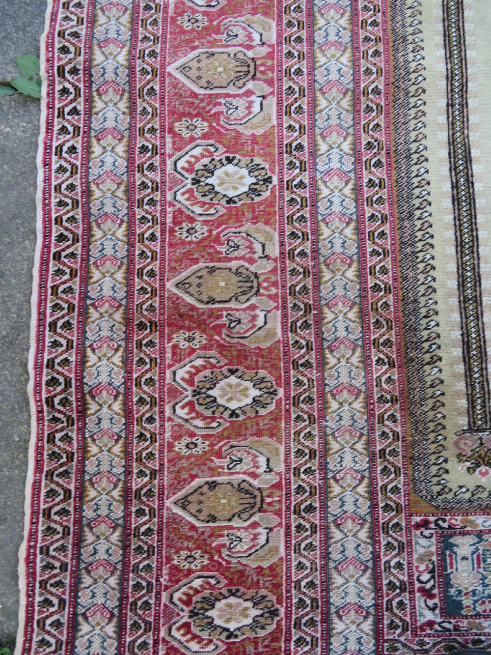 An antique Turkish Kayseri prayer rug featuring a central pale pistachio green field with a mihrab niche surrounded by intricate floral borders in coral pink and cream. View XIII
