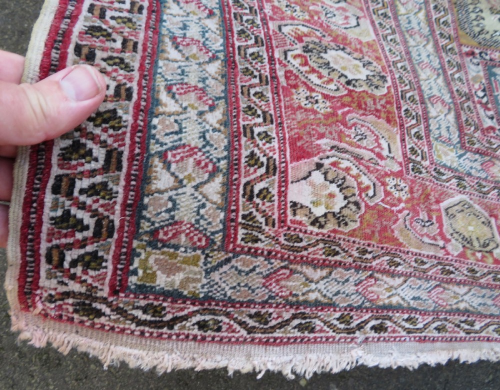An antique Turkish Kayseri prayer rug featuring a central pale pistachio green field with a mihrab niche surrounded by intricate floral borders in coral pink and cream. View XIV