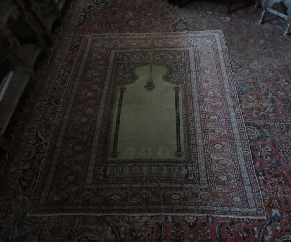 An antique Turkish Kayseri prayer rug featuring a central pale pistachio green field with a mihrab niche surrounded by intricate floral borders in coral pink and cream. View XXVI