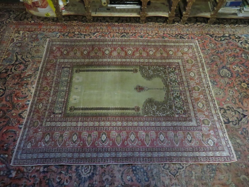 An antique Turkish Kayseri prayer rug featuring a central pale pistachio green field with a mihrab niche surrounded by intricate floral borders in coral pink and cream. View XXVIII