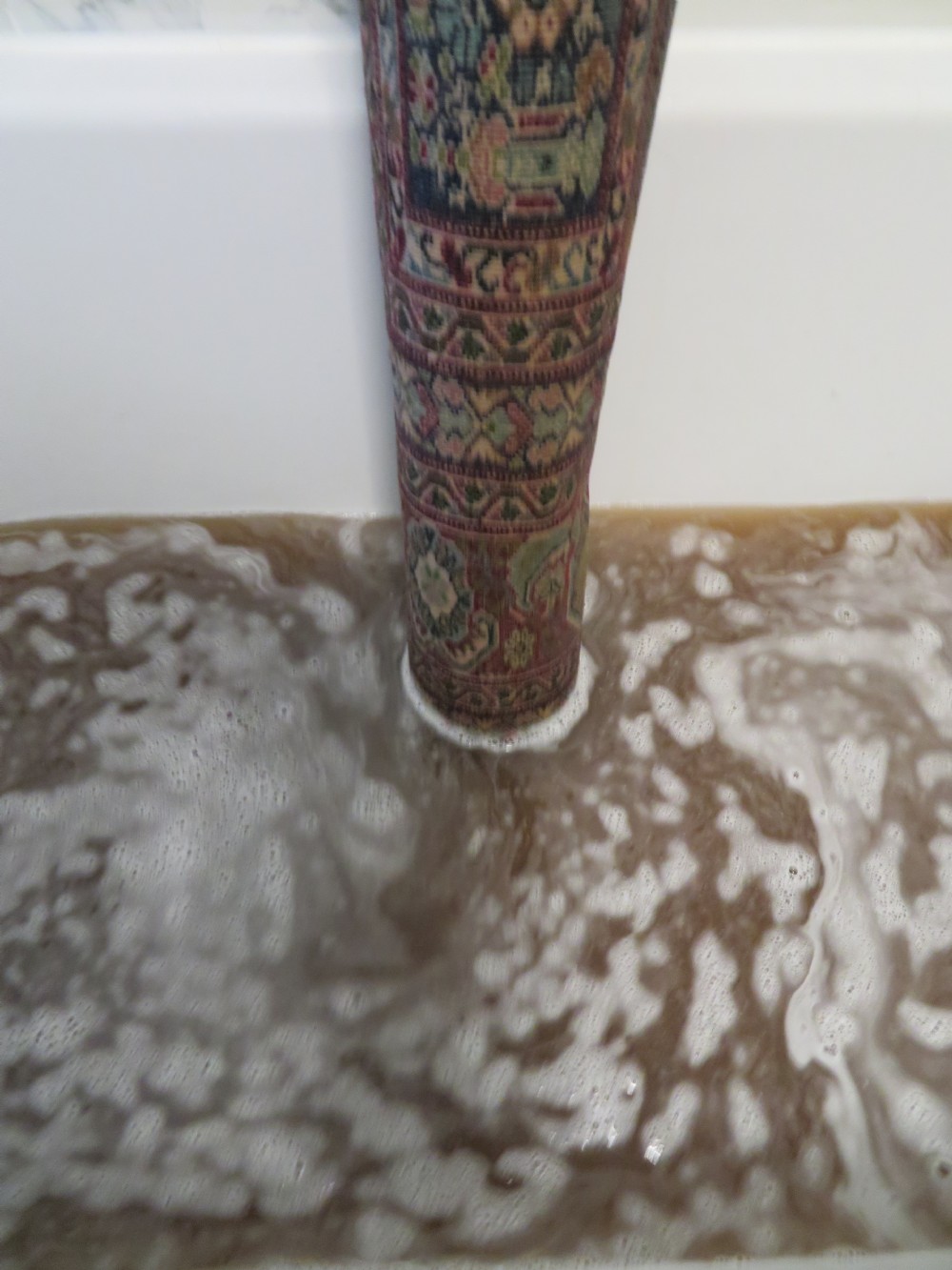 An antique Turkish Kayseri prayer rug featuring a central pale pistachio green field with a mihrab niche surrounded by intricate floral borders in coral pink and cream. View XXX