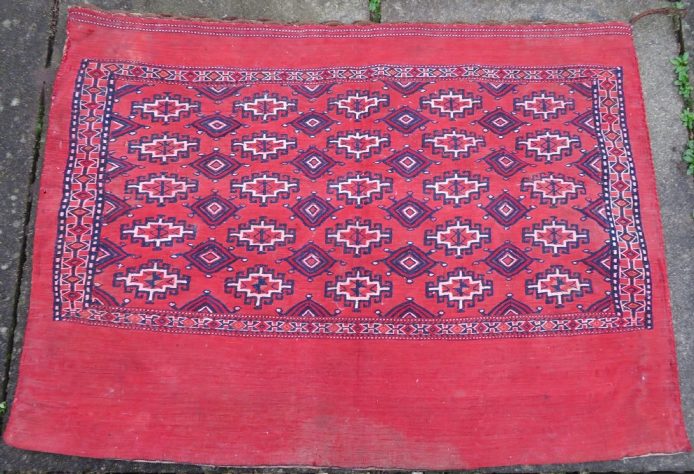 EARLY ANTIQUE SARYK TEKKE TURKMEN CHUVAL.COMPLETE WITH PLAIN WEAVE BACK.FLAT WOVEN DETAILS. MID 19TH CENTURY .