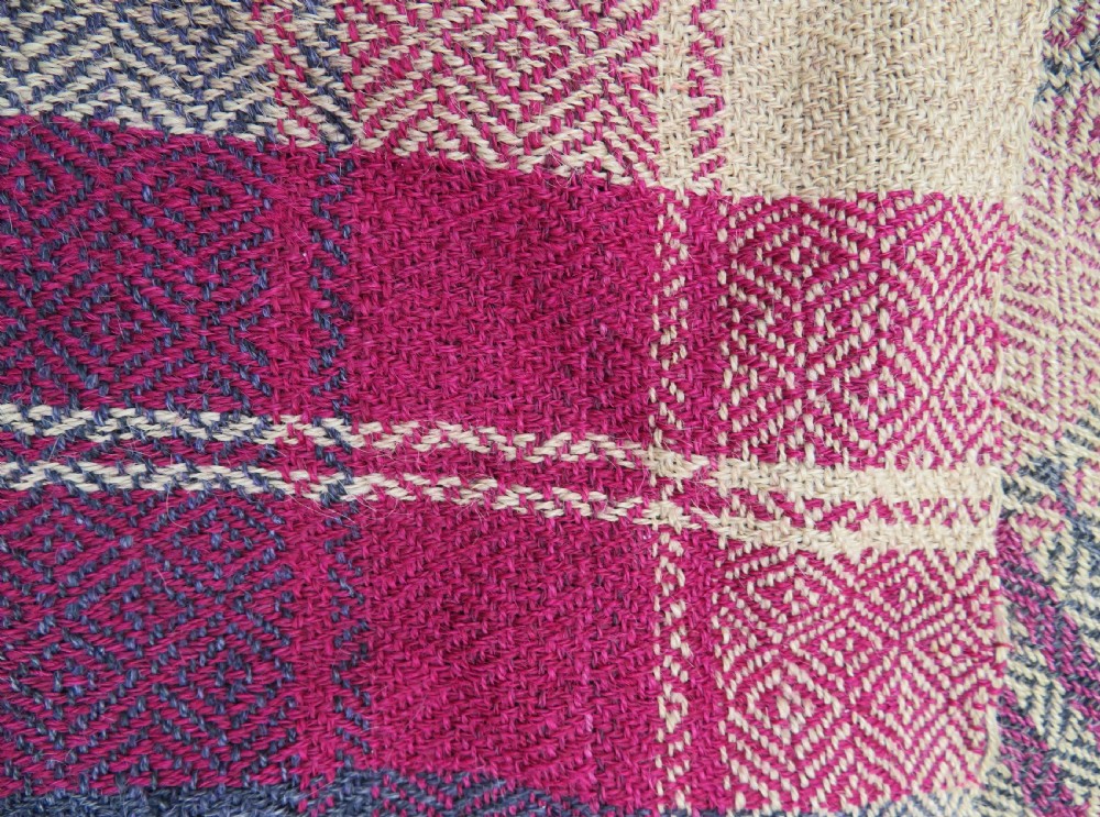 A rectangular flat-woven wool textile featuring crimson, navy, and cream geometric checked patterns with fringed ends. View XXII