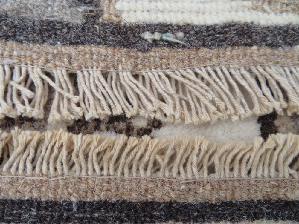 A rectangular hand-knotted cream wool rug featuring two central dragon medallions, a key meander border, and grey decorative motifs. View XVI