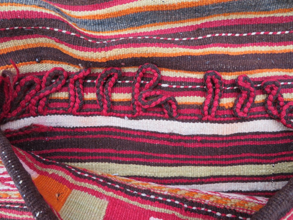 An antique woven wool Azerbaijan saddle bag displaying geometric serrated motifs in red, cream, and dark brown. View VIII