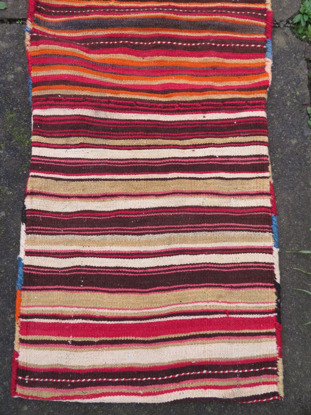 An antique woven wool Azerbaijan saddle bag displaying geometric serrated motifs in red, cream, and dark brown. View XVI