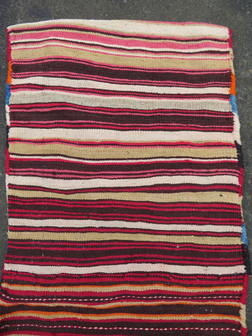 An antique woven wool Azerbaijan saddle bag displaying geometric serrated motifs in red, cream, and dark brown. View XVII