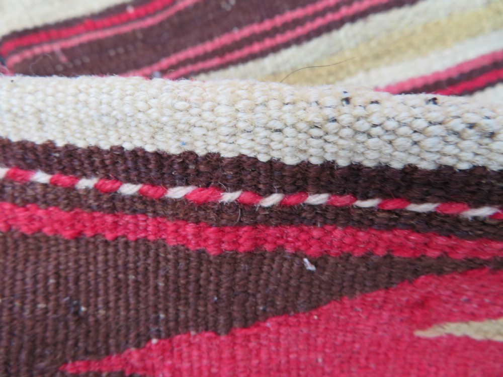 An antique woven wool Azerbaijan saddle bag displaying geometric serrated motifs in red, cream, and dark brown. View XXIII
