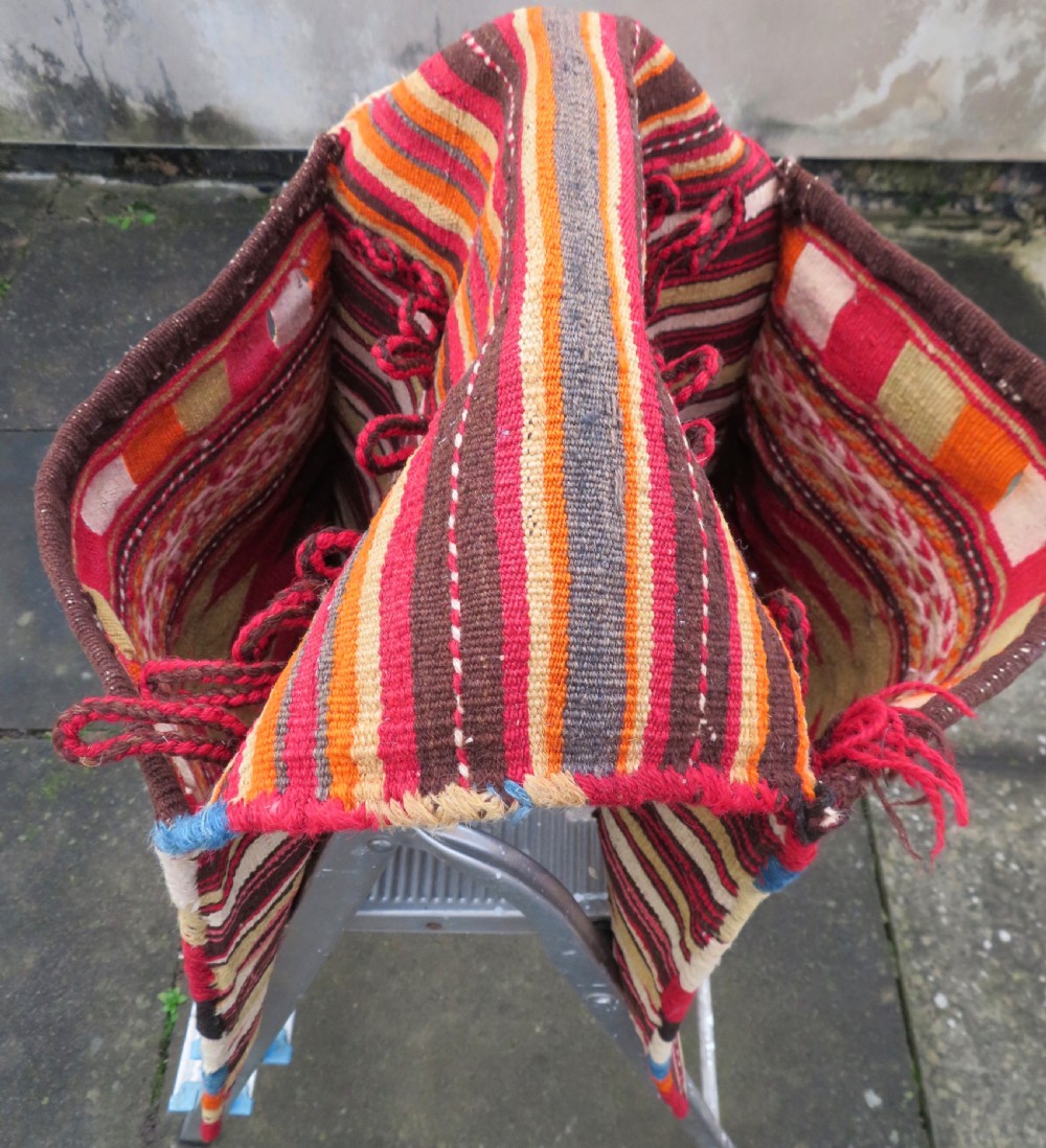 An antique woven wool Azerbaijan saddle bag displaying geometric serrated motifs in red, cream, and dark brown. View XXIV