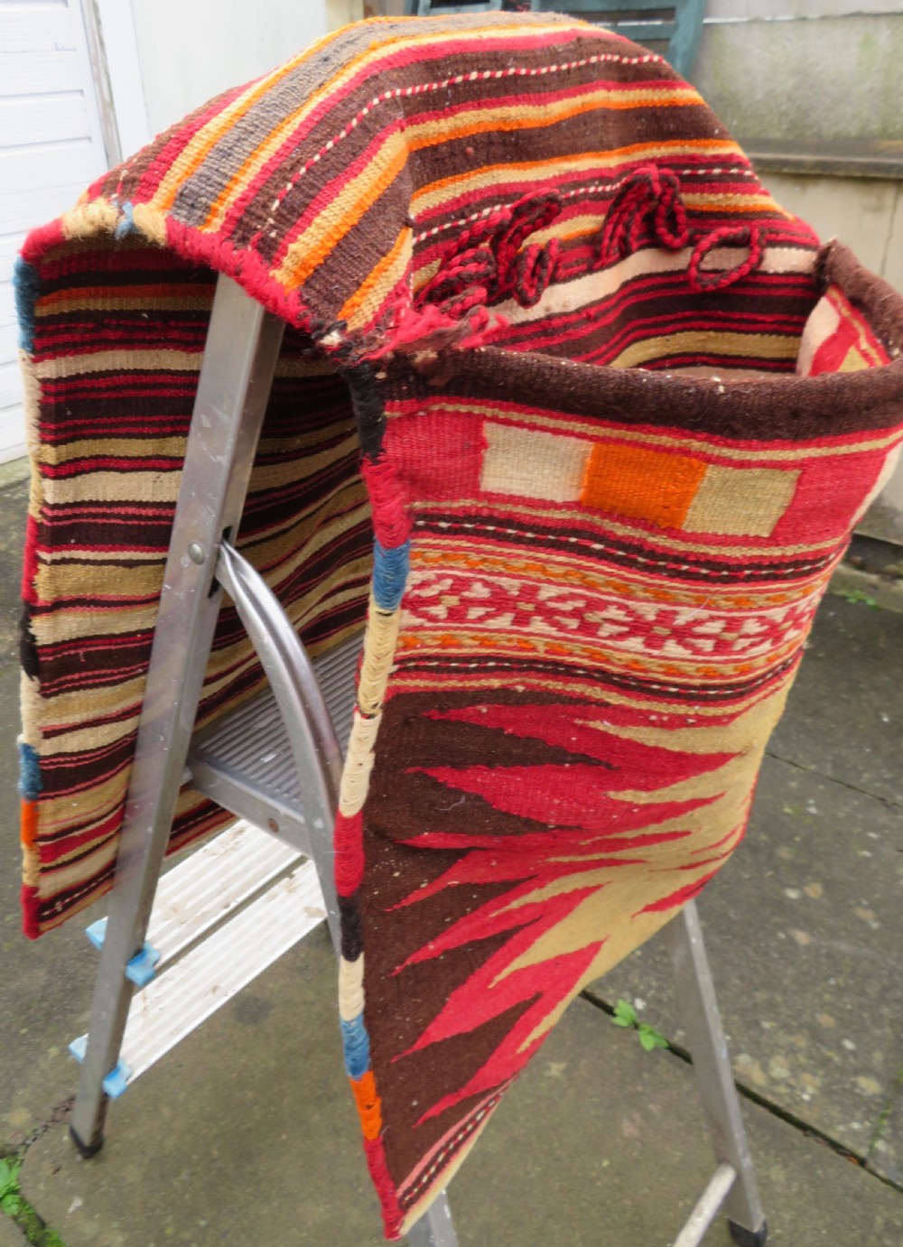 An antique woven wool Azerbaijan saddle bag displaying geometric serrated motifs in red, cream, and dark brown. View XXV