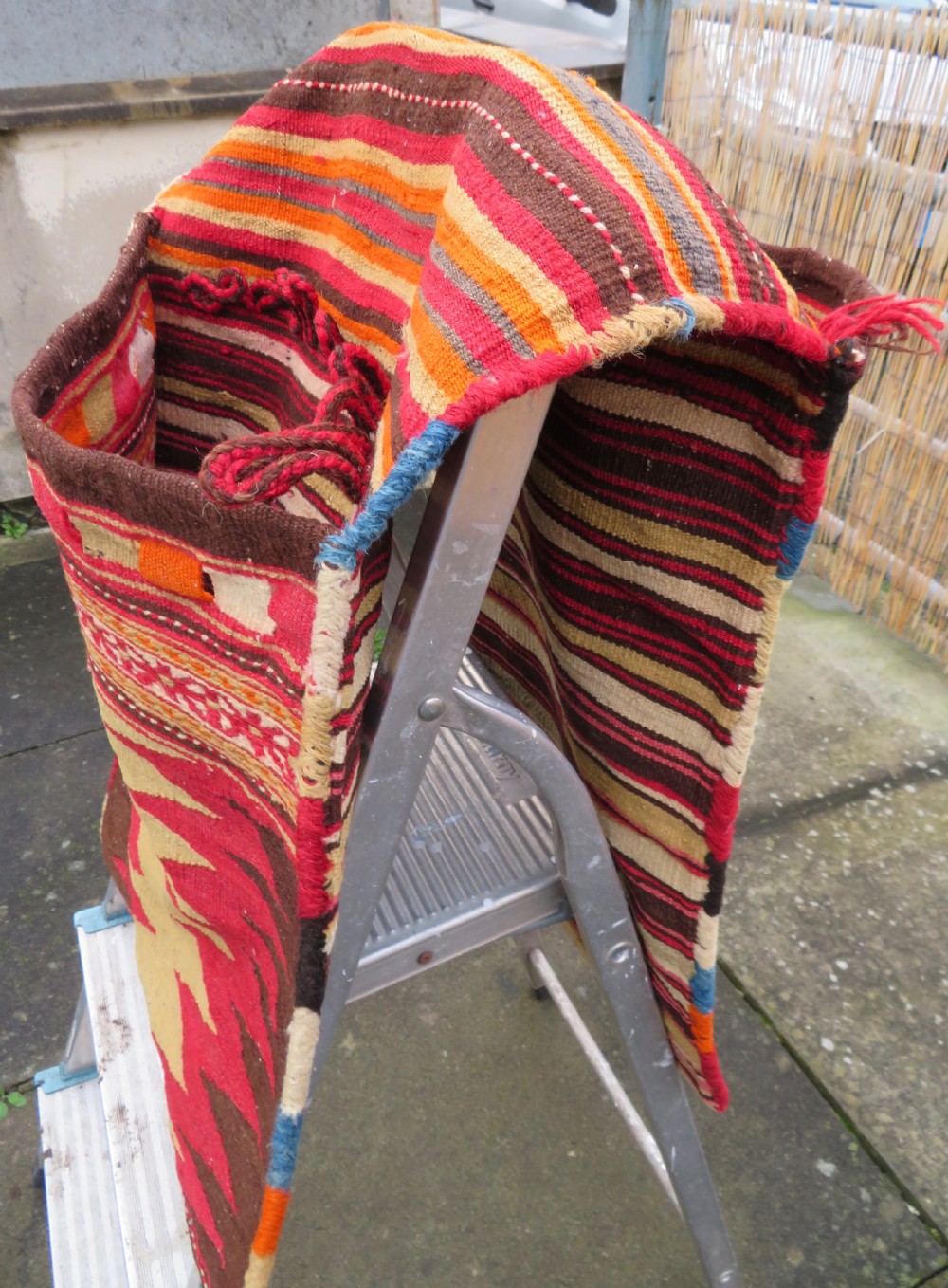 An antique woven wool Azerbaijan saddle bag displaying geometric serrated motifs in red, cream, and dark brown. View XXVI