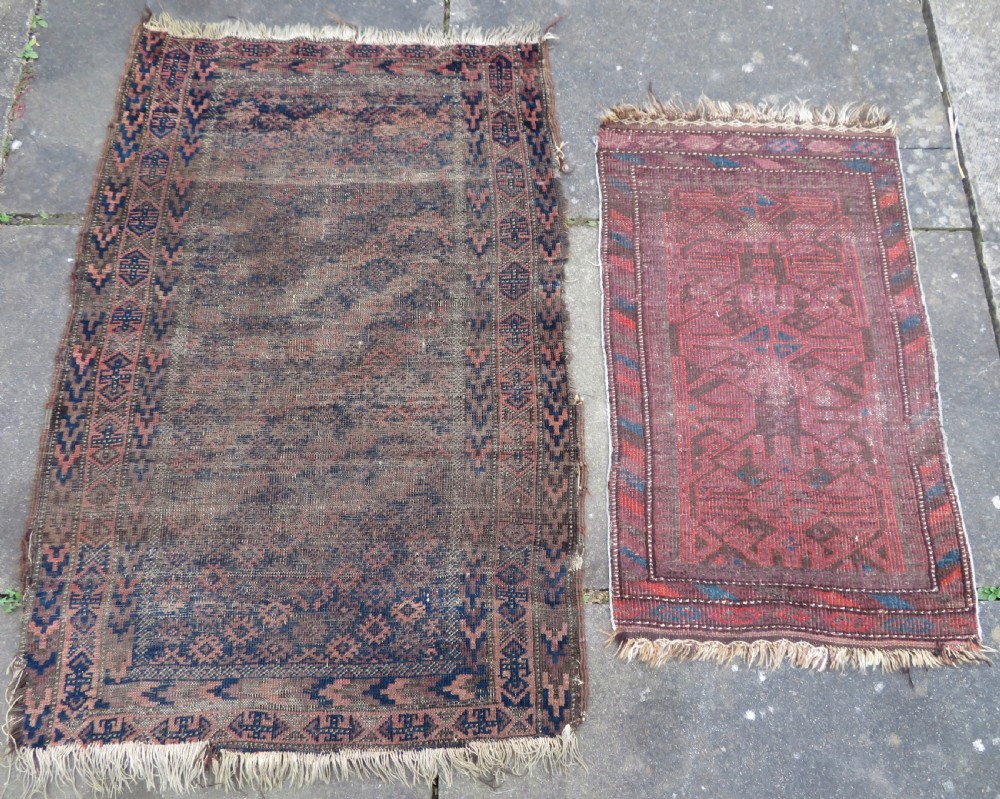 2 X ANTIQUE DISTRESSED BALUCH RUGS. NORTH EAST PERSIA. 118CM X 82CM. 88CM X 64CM.