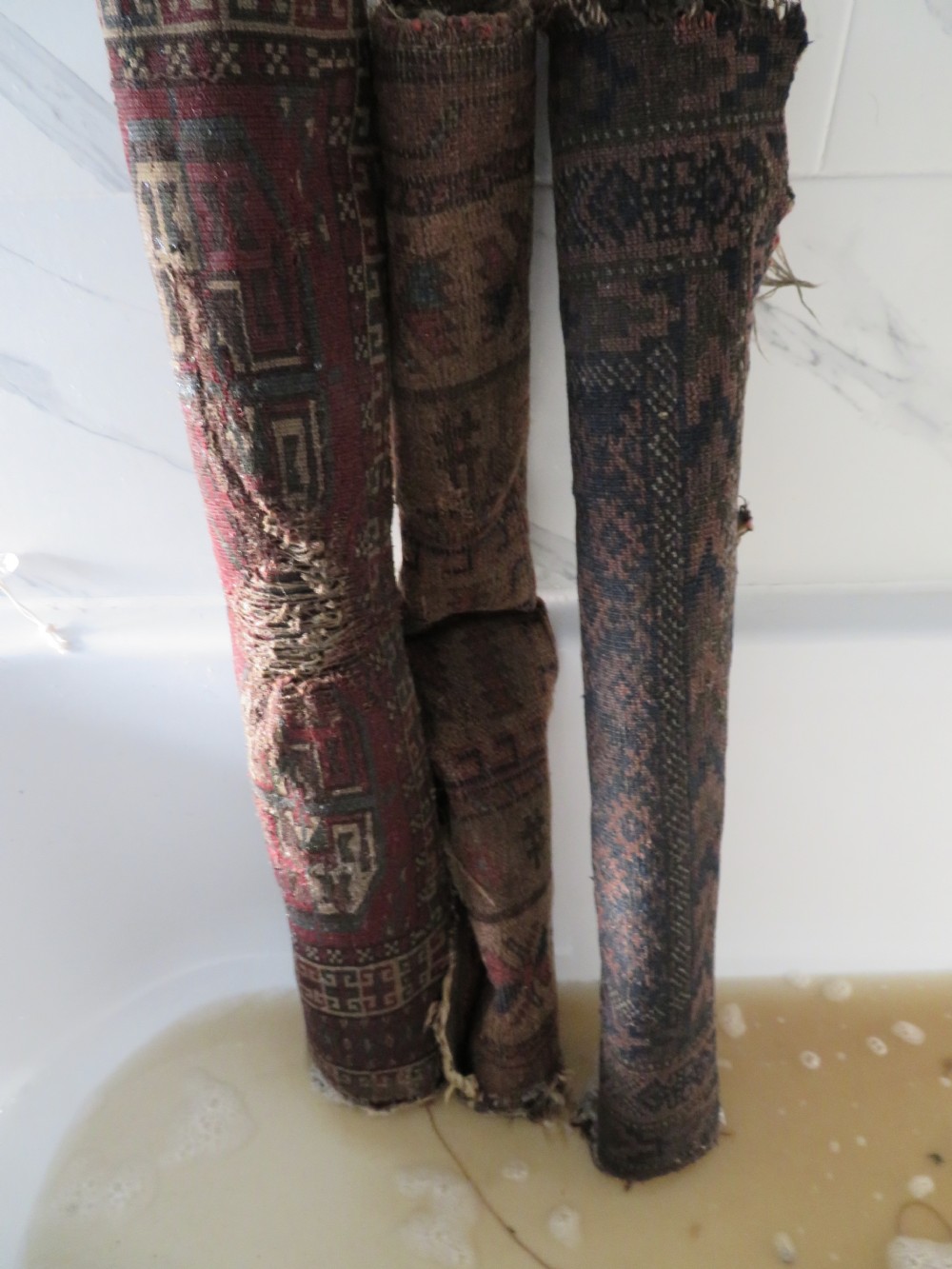 2 X ANTIQUE DISTRESSED BALUCH RUGS. NORTH EAST PERSIA. 118CM X 82CM. 88CM X 64CM. View XIX