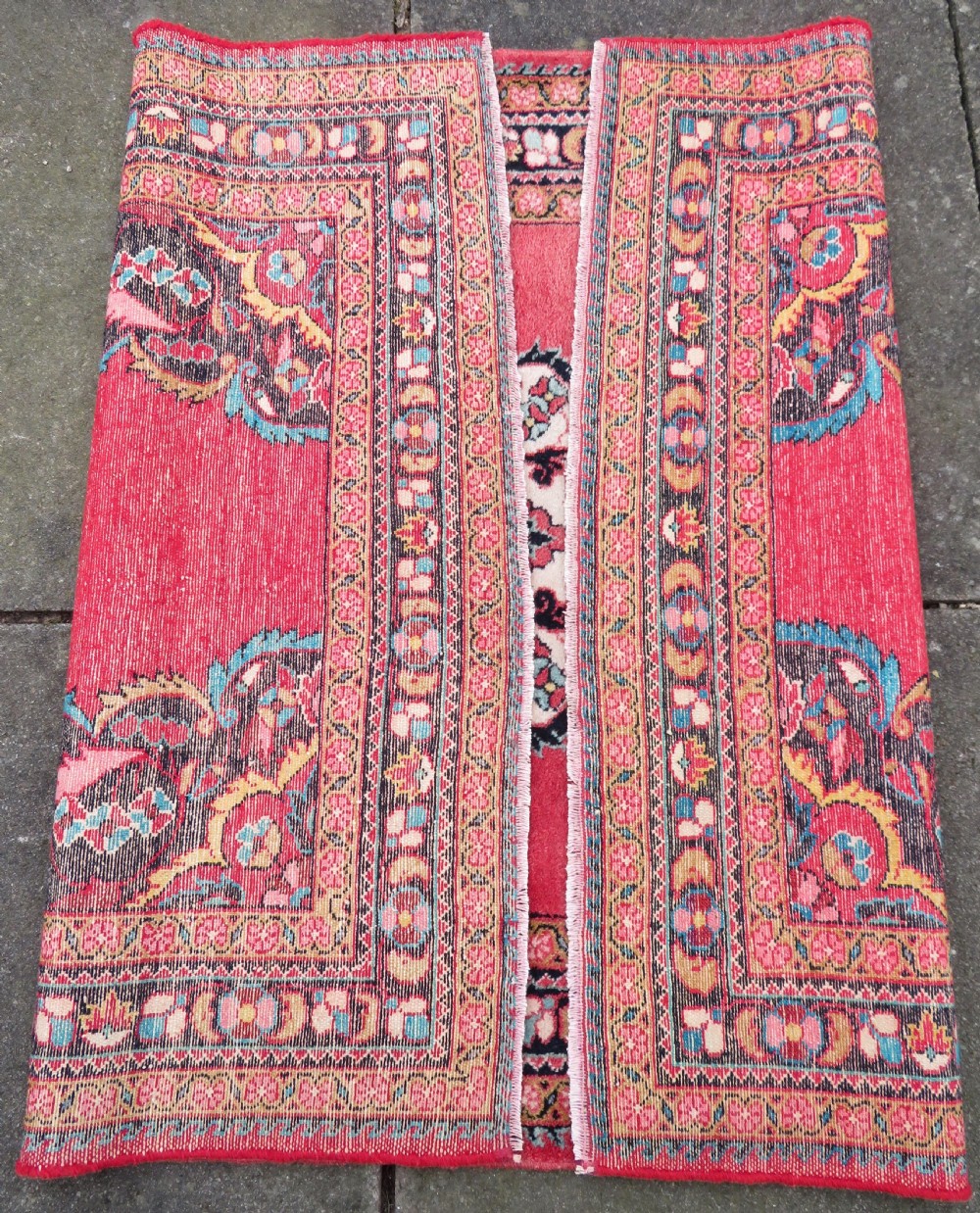 An antique Jozan Persian rug featuring a central floral medallion on a rose red field surrounded by intricate spandrels and multi-band patterned borders. View XVI