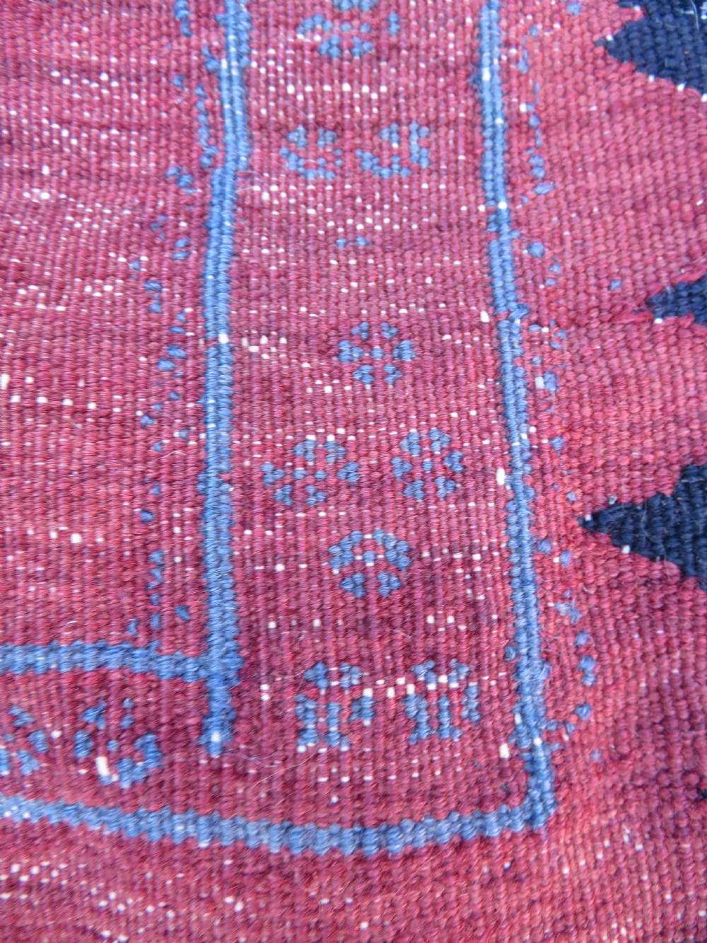Square flatwoven antique Afshar sofreh rug featuring a central pink diamond medallion framed by nested red and navy blue stepped geometric borders. View XI