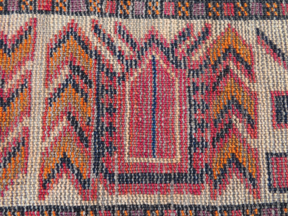 An antique hand-knotted Turkish Kurdish wool rug featuring a central terracotta diamond medallion surrounded by geometric motifs in dark indigo, cream, and orange shades. View XX