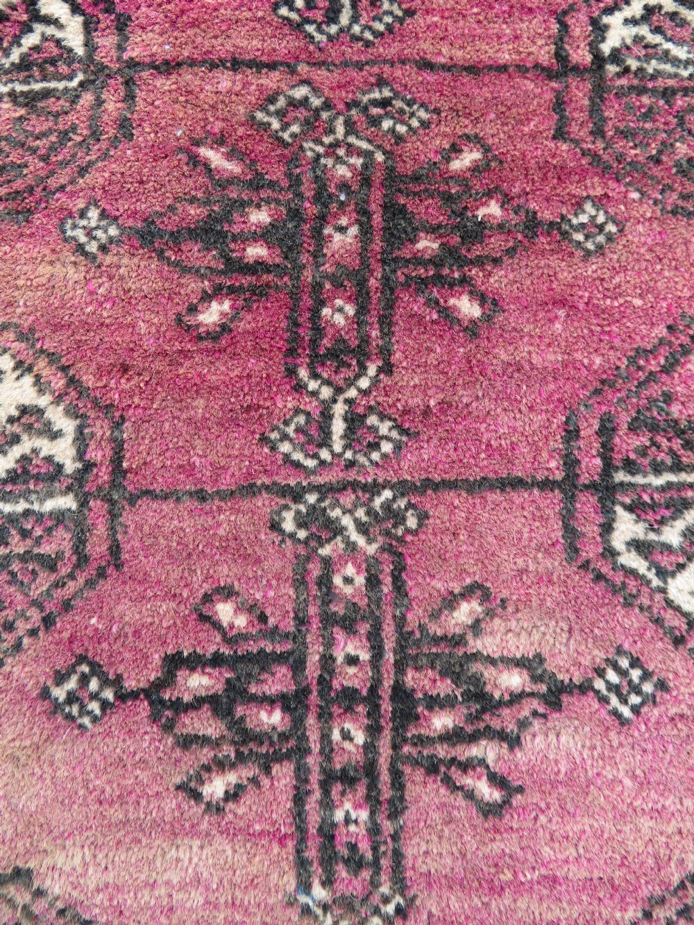 An antique hand-knotted Turkmen Kizil Ayak wool prayer rug featuring a triple mihrab arch design in deep red, dark blue, and charcoal shades. View XV