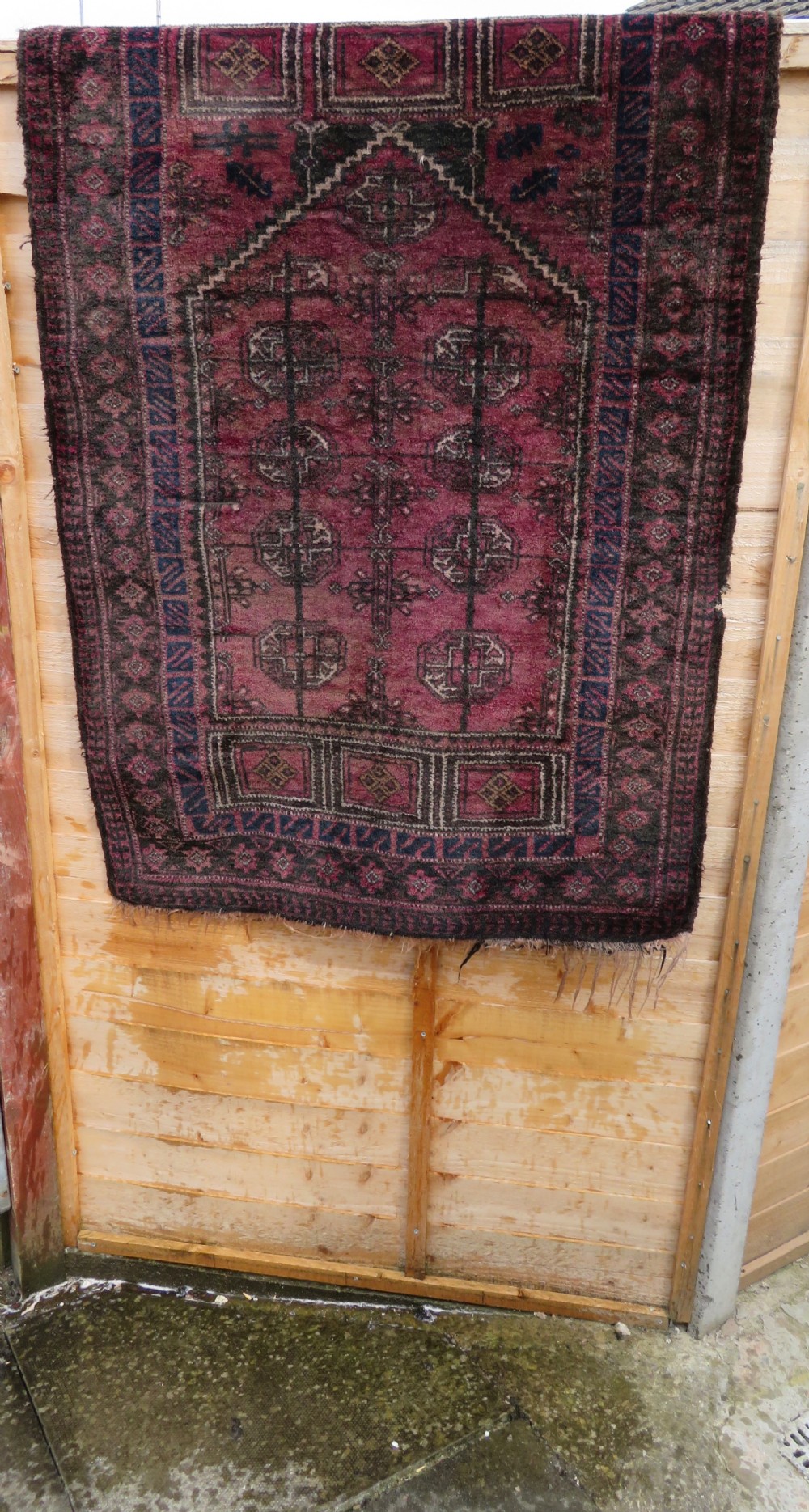 An antique hand-knotted Turkmen Kizil Ayak wool prayer rug featuring a triple mihrab arch design in deep red, dark blue, and charcoal shades. View XXII