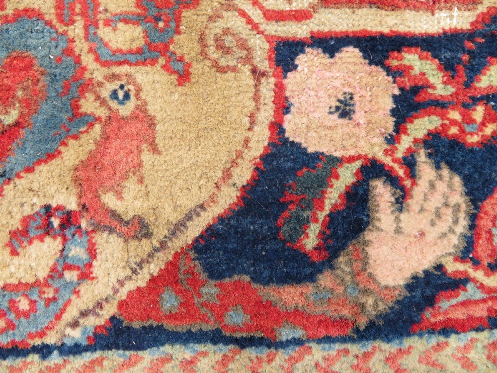 An antique hand-knotted North West Persian Tabriz rug featuring a central floral medallion surrounded by detailed terracotta red, navy blue, and cream motifs. View VI