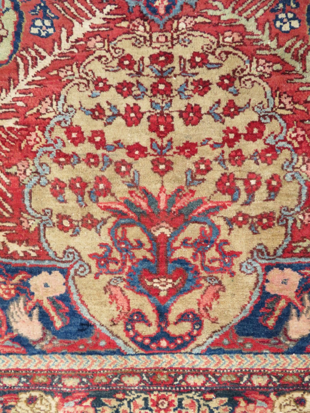 An antique hand-knotted North West Persian Tabriz rug featuring a central floral medallion surrounded by detailed terracotta red, navy blue, and cream motifs. View VIII