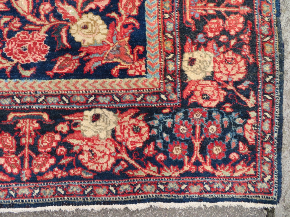 An antique hand-knotted North West Persian Tabriz rug featuring a central floral medallion surrounded by detailed terracotta red, navy blue, and cream motifs. View XII
