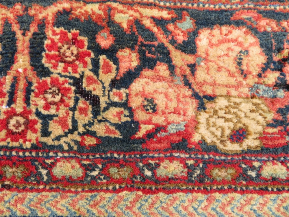An antique hand-knotted North West Persian Tabriz rug featuring a central floral medallion surrounded by detailed terracotta red, navy blue, and cream motifs. View XV