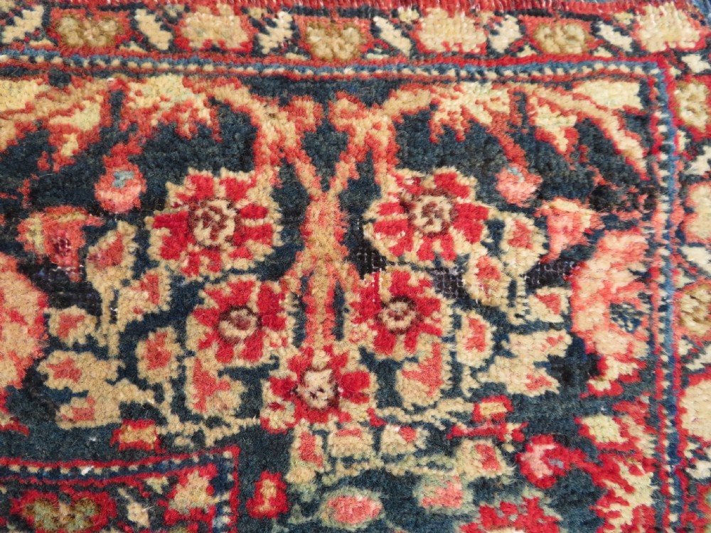 An antique hand-knotted North West Persian Tabriz rug featuring a central floral medallion surrounded by detailed terracotta red, navy blue, and cream motifs. View XVI