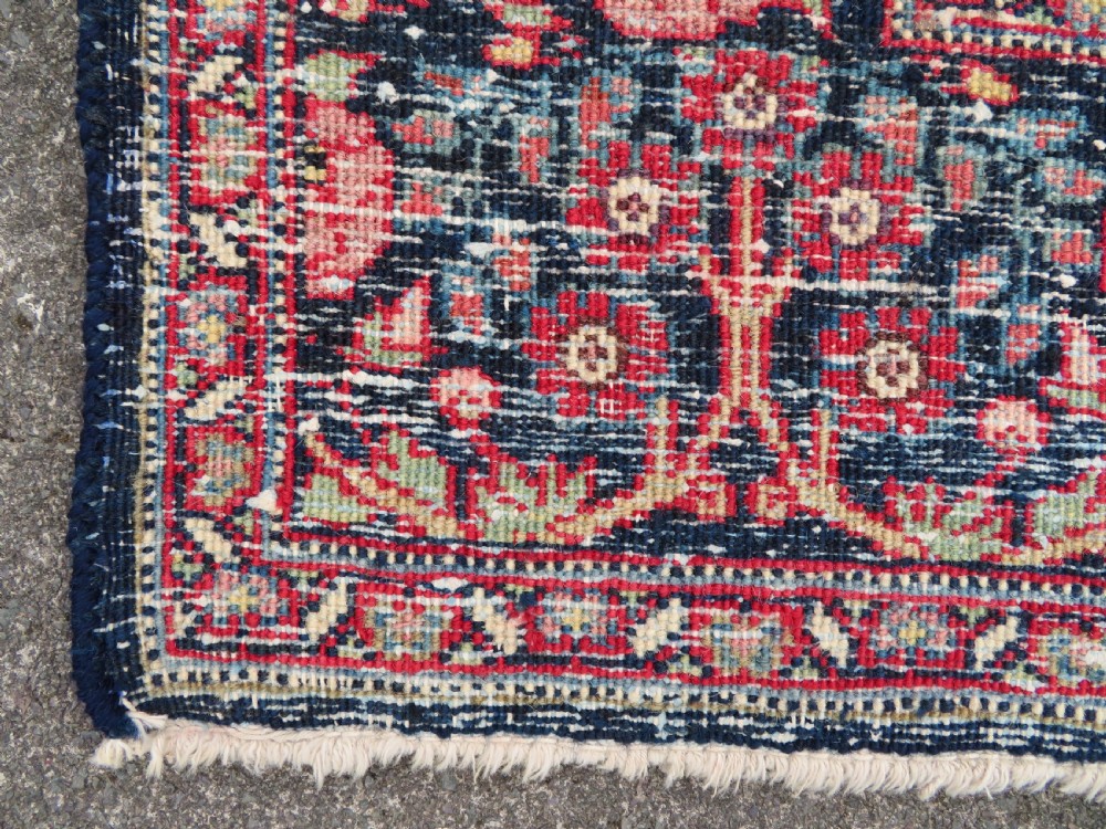 An antique hand-knotted North West Persian Tabriz rug featuring a central floral medallion surrounded by detailed terracotta red, navy blue, and cream motifs. View XX