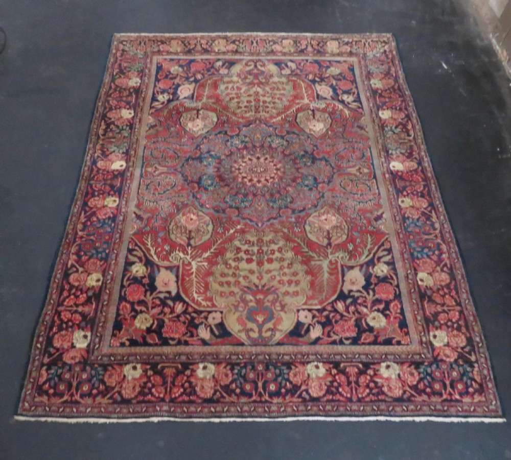 An antique hand-knotted North West Persian Tabriz rug featuring a central floral medallion surrounded by detailed terracotta red, navy blue, and cream motifs. View XXVI