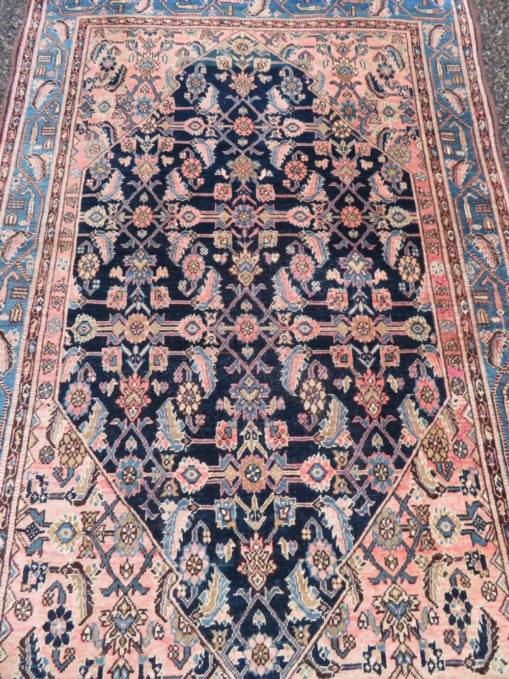 A hand-knotted Bidjar Persian rug featuring a navy blue diamond medallion, salmon pink spandrels, and multi-layered blue floral borders. View IV